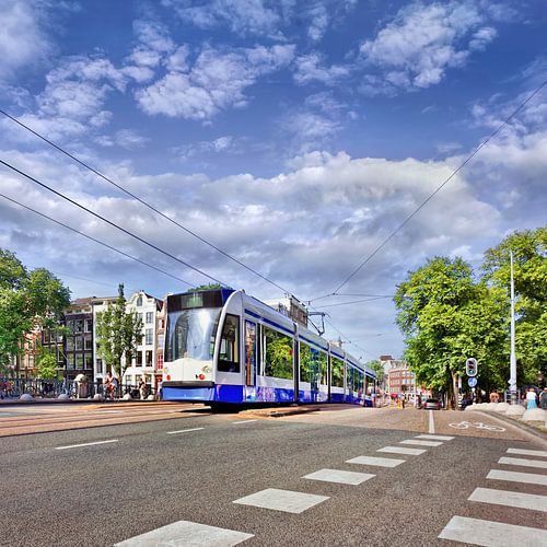 Approaching tram on a road with markings in Amsterdam