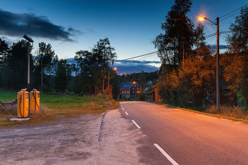 Old Shell petrol pump along a quiet paved road