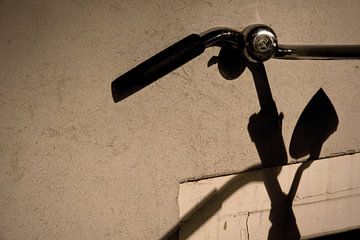 Bicycle shadow by Martijn van Huffelen