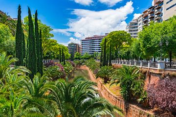 Citycape with water canal stream and park in Palma de Majorca, Spain by Alex Winter