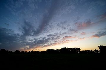 Wolken tijdens zonsondergang van Robrecht Kruft