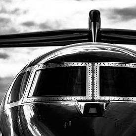 A private plane straight from the front in black and white by Dennis Dieleman