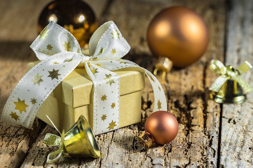 Christmas gift box with ribbon bow, golden baubles by Alex Winter