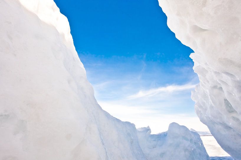 view of the blue sky from an ice crack in the hummocks on Lake Baikal by Michael Semenov