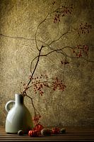 a vase with a beautiful autumn branch with berries