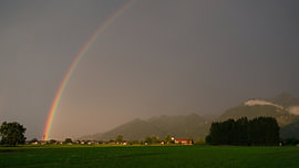 Rainbow in the mountains by Remco Nijland