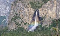 Waterfall with rainbow in Yosemite by Reis Genie thumbnail