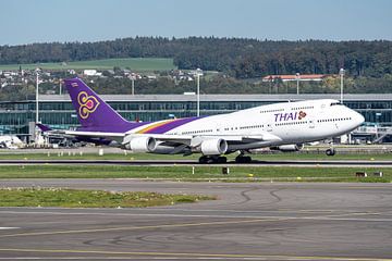 A Thai Airways Boeing 747-400 takes off from Zurich airport for a flight to beautiful and warm Thail by Jaap van den Berg