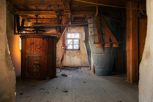 Historic Mill with Wooden Mechanics and Funnels in an Abandoned Barn