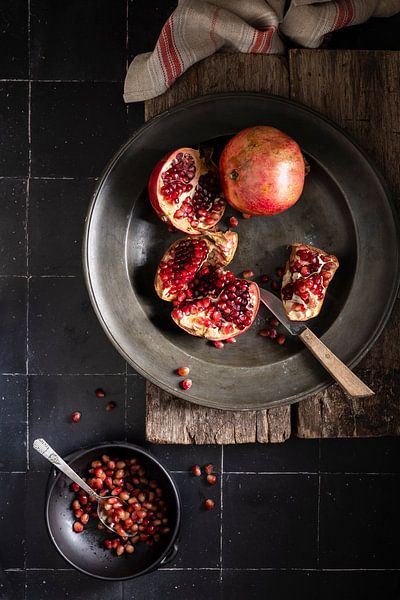 Pomegranates on tin plate by Saskia Schepers