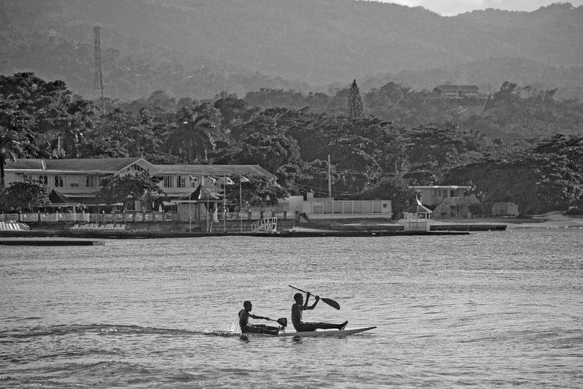 Children on a surfboard in front of Ocho Rios / Jamaica by t.ART