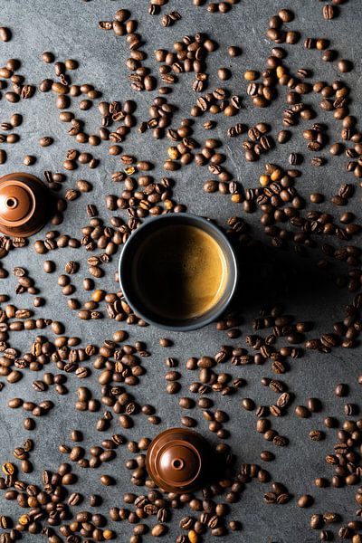 Coffee cup with beans by Jim Plaum
