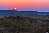 Zonsondergang boven de duinen
