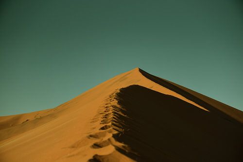 Desert landscape with sand dunes and sky in Deadvlei.
