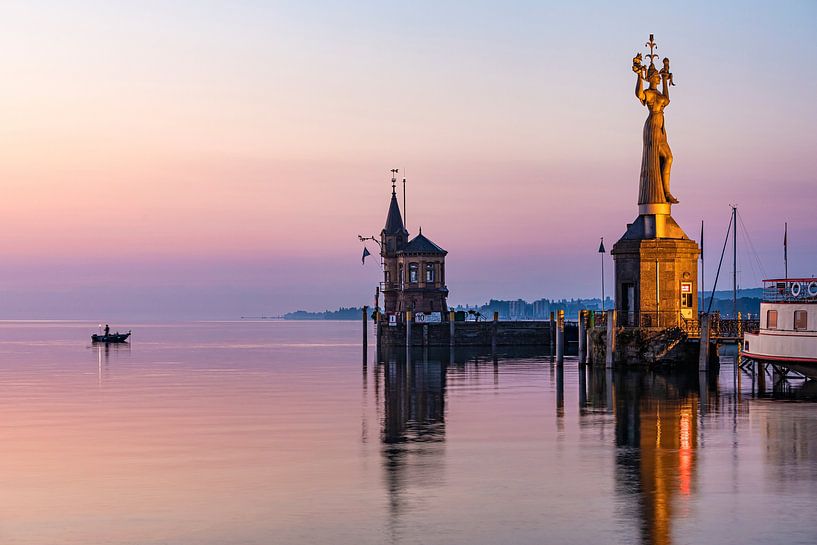 A fisherman and the Imperia in Constance on Lake Constance by Werner Dieterich