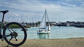 A bicycle and a sailing boat at the harbour by Herbert Böck
