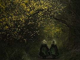 Twins in Green Dresses Under Yellow Blossom by Karina Brouwer