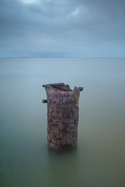 Rusty pole in the water, minimalist by Rick Goede