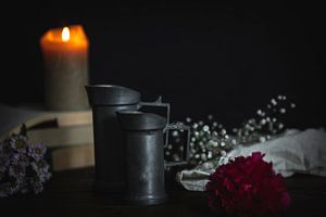Still life with burning candle