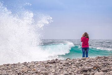 Young girl watching a stormy sea. by Carlos Charlez