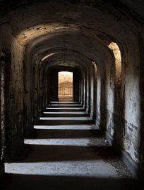 Abandoned corridor with cells by Nancy Bogaert