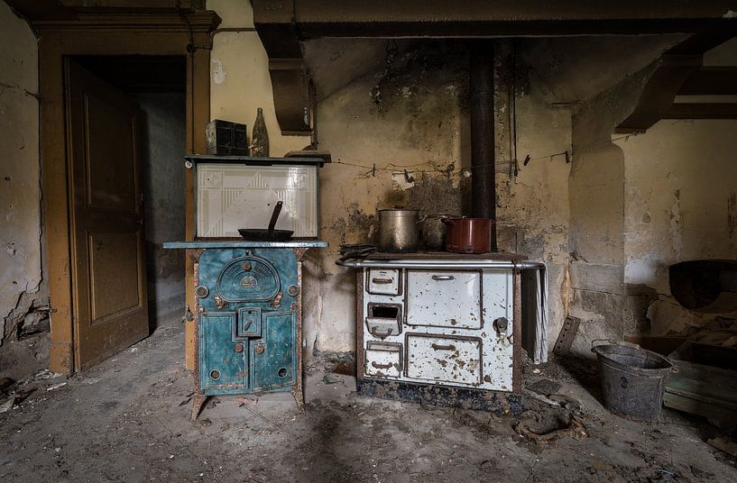 Kitchen in abandoned house by Inge van den Brande