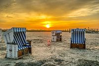 Beach chairs at the North Sea at sunset