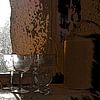 Antique glasses and teapot in small kitchen window by Susan Hol