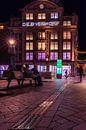 Menschen vor dem Bijenkorf in Amsterdam am Abend von Bart Ros Miniaturansicht