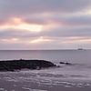 Zonsondergang aan zee van Philipp Klassen
