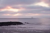 Zonsondergang aan zee