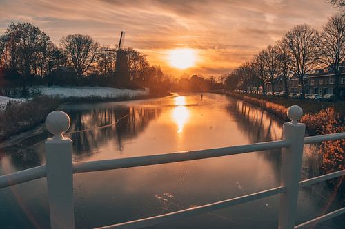 Sunset with mill and ice