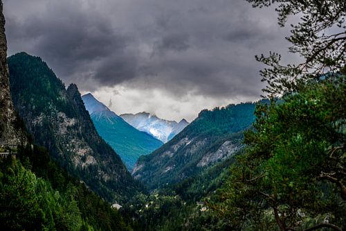Threatening skies over a hidden mountain valley