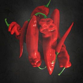 Peppers & peppers on black by Miranda van Hulst