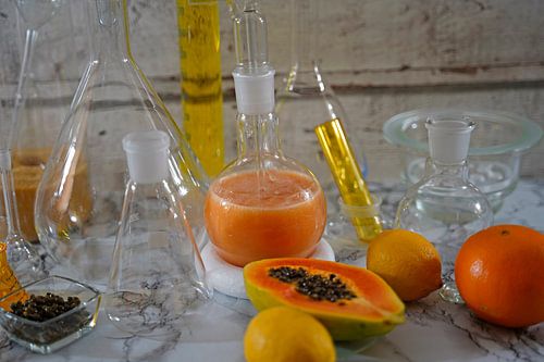 Papaya cocktail met rum, citroen en sinaasappel
