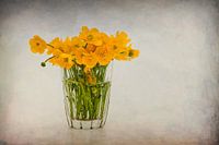 Glass with buttercups.