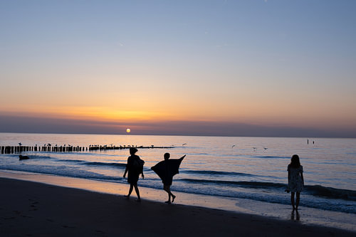 walk in the surf during the blue hour