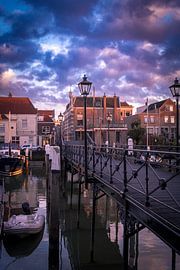 De Lange IJzeren Brug in Dordrecht met zonsondergang van Lizanne van Spanje