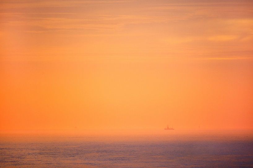 Fishing boat at sunset on the Wadden Sea near Friesland by Marcel van Kammen