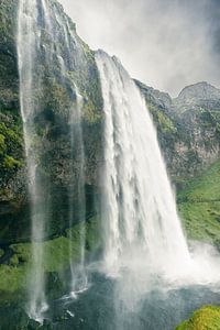 Seljalandsfoss Waterfall in Iceland on a cloudy and stormy day.