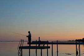 Pêcheur au coucher du soleil