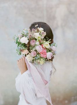 Woman with pastel flowers, analogue photograph by Alexandra Vonk