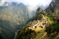Machu Picchu at sunrise in the fog