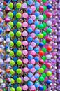 Close-up of cheerful multicolored bead strings by Tony Vingerhoets thumbnail