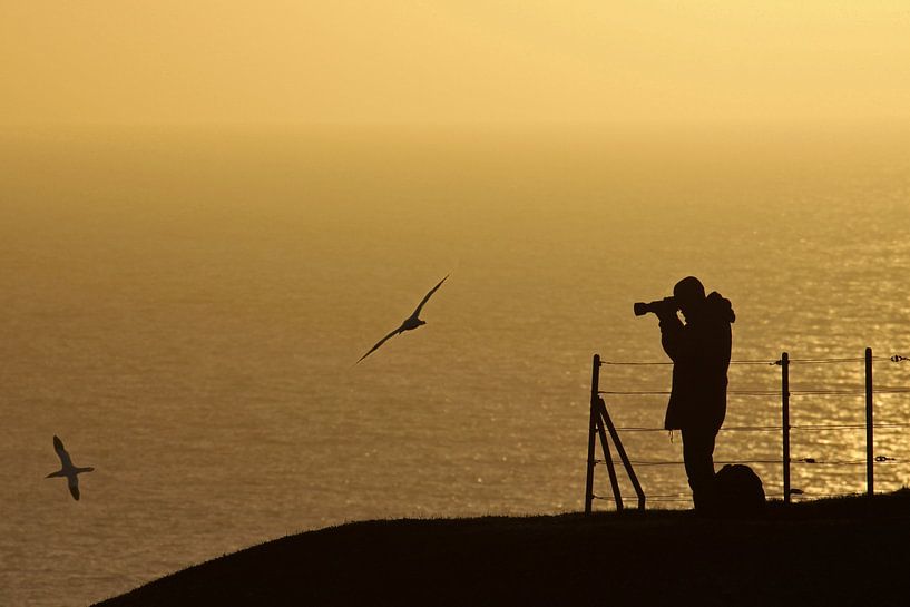photographer during sunset by Antwan Janssen