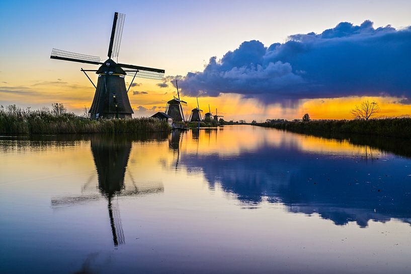 Rain shower over kinderdijk by Jack Dwarswaard