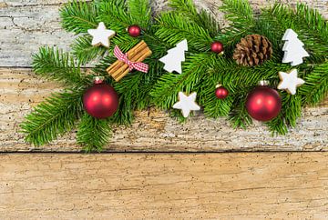 Rustic Christmas background with decorations and fir tree branch on wood, copy space by Alex Winter