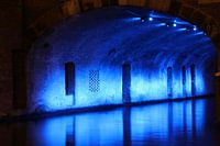 Oudegracht under the bridge at night