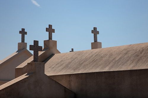 The quiet conversation between the crosses and the sky.