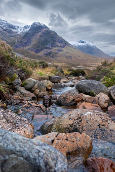 Rocks and Snow-Capped Peaks in Glencoe